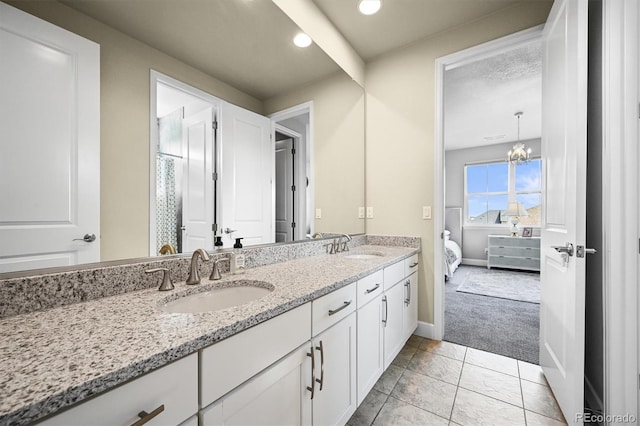 15033 Delhi Ave, Parker, CO 80134 - bathroom with double vanity, baseboards, connected bathroom, and recessed lighting