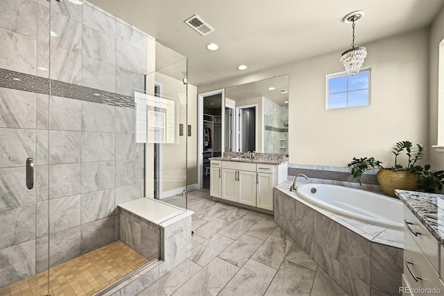 15033 Delhi Ave, Parker, CO 80134 - full bathroom featuring a shower stall, vanity, marble look tiles, a garden tub, and recessed lighting