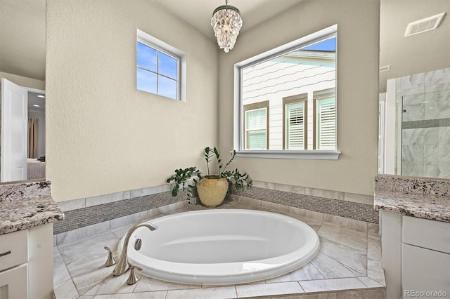 15033 Delhi Ave, Parker, CO 80134 - full bathroom featuring vanity, a bath, a chandelier, and plenty of natural light