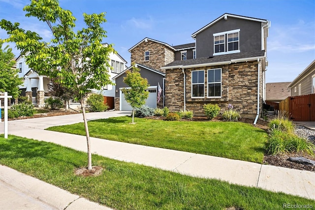 15033 Delhi Ave, Parker, CO 80134 - view of front of house with driveway, a garage, stone siding, and stucco siding