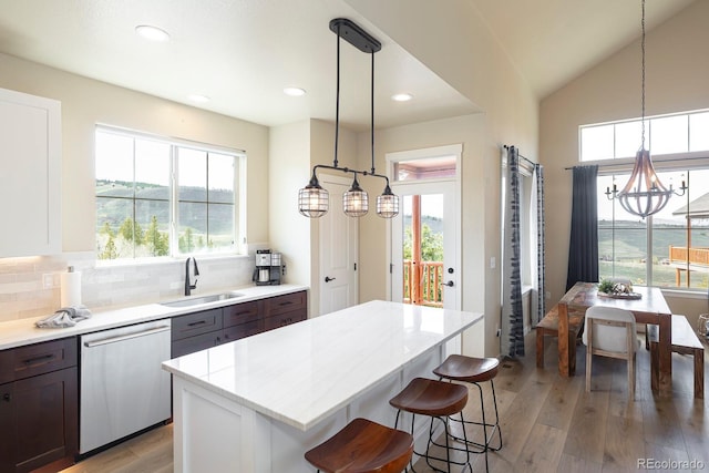 327 Summit Lift Ct, Granby, CO 80446 - kitchen with dishwasher, a sink, light wood-style flooring, plenty of natural light, and recessed lighting