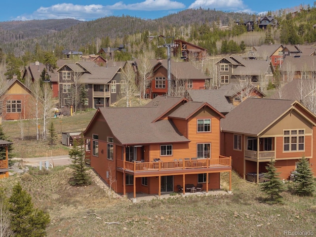 327 Summit Lift Ct, Granby, CO 80446 - rear view of house featuring a mountain view, a residential view, and roof with shingles