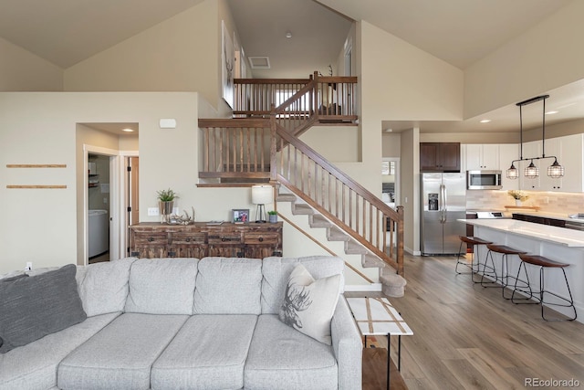 327 Summit Lift Ct, Granby, CO 80446 - living area with high vaulted ceiling, light wood-style floors, stairs, and recessed lighting