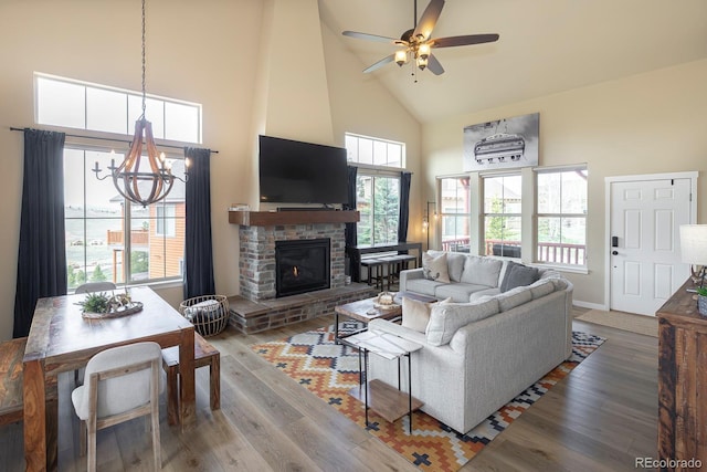 327 Summit Lift Ct, Granby, CO 80446 - living area featuring high vaulted ceiling, wood finished floors, a chandelier, and plenty of natural light