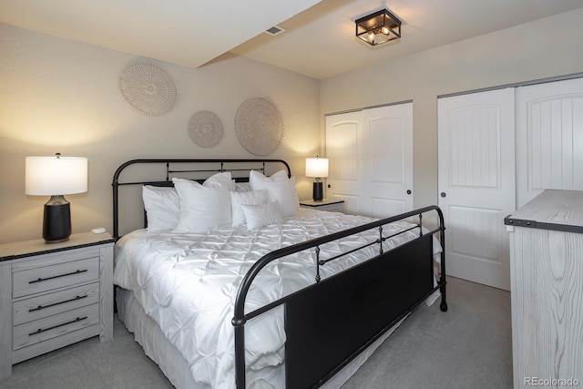 327 Summit Lift Ct, Granby, CO 80446 - bedroom featuring light carpet and two closets