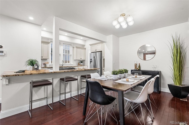 dining room featuring dark wood-style floors, recessed lighting, and baseboards