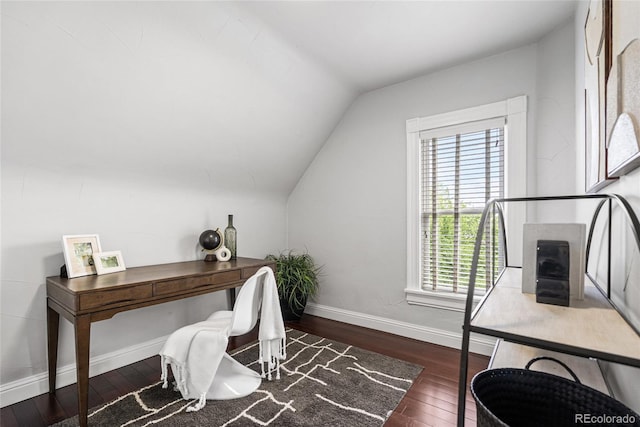 office featuring vaulted ceiling, healthy amount of natural light, hardwood / wood-style floors, and baseboards