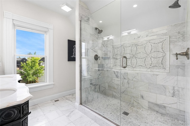 bathroom featuring baseboards, a marble finish shower, marble finish floors, double vanity, and recessed lighting