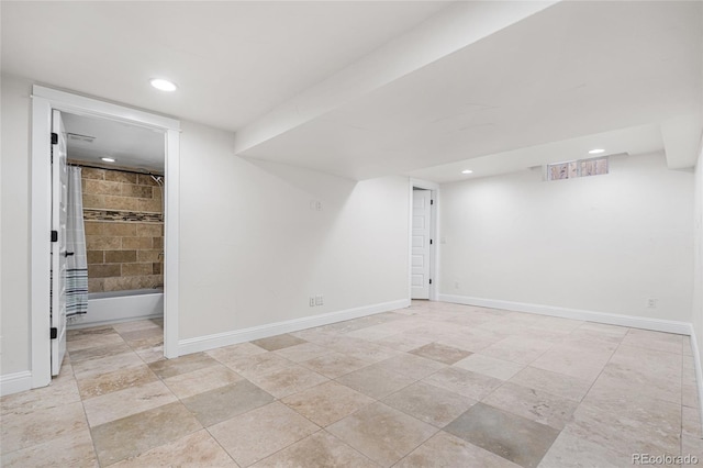 finished basement featuring recessed lighting and baseboards
