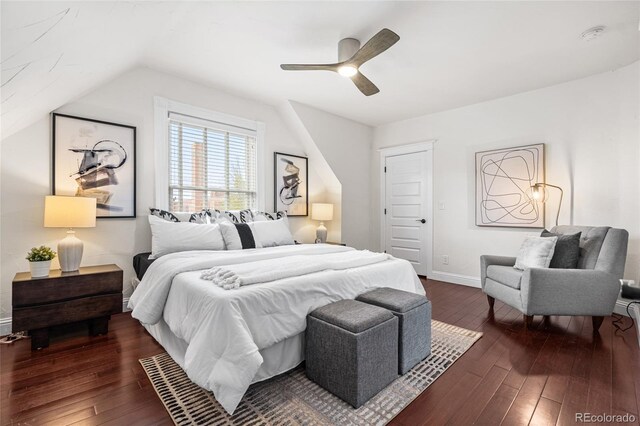 bedroom with dark wood-style flooring, baseboards, vaulted ceiling, and ceiling fan