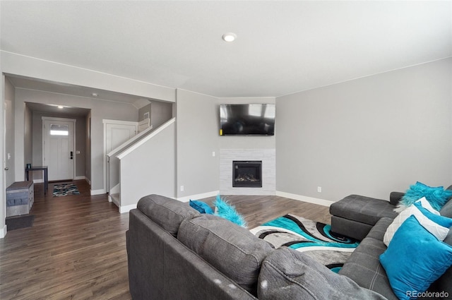 2128 Dexter St, Mead, CO 80542 - living room with wood finished floors, stairs, and a glass covered fireplace