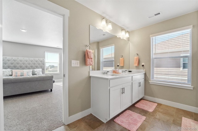 2128 Dexter St, Mead, CO 80542 - ensuite bathroom with double vanity and tile patterned floors