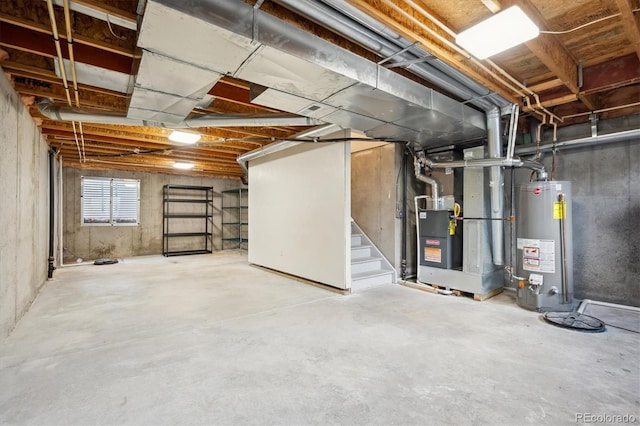 basement featuring water heater and stairs