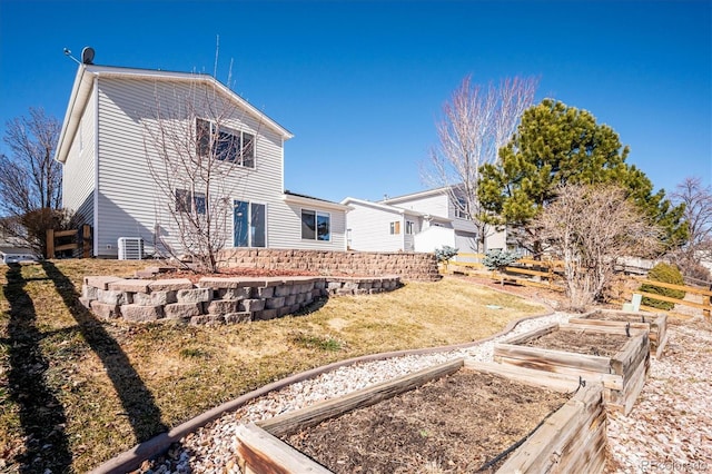 exterior space with a garden and a yard