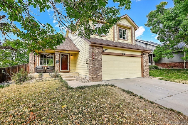 19873 E Vassar Ave, Aurora, CO 80013 - view of front of property with brick siding, concrete driveway, a garage, and a shingled roof