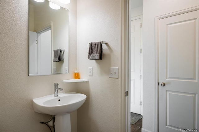 bathroom with a textured wall