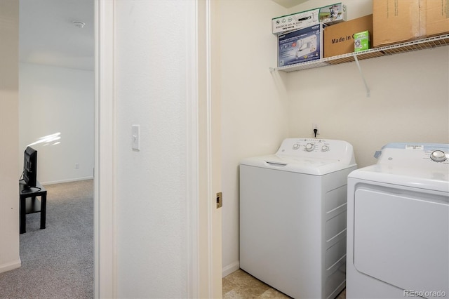 laundry room with light carpet, laundry area, independent washer and dryer, and baseboards