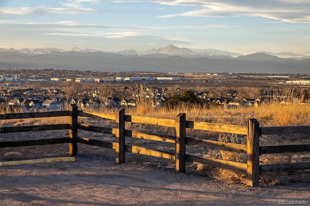 exterior space with fence and a mountain view