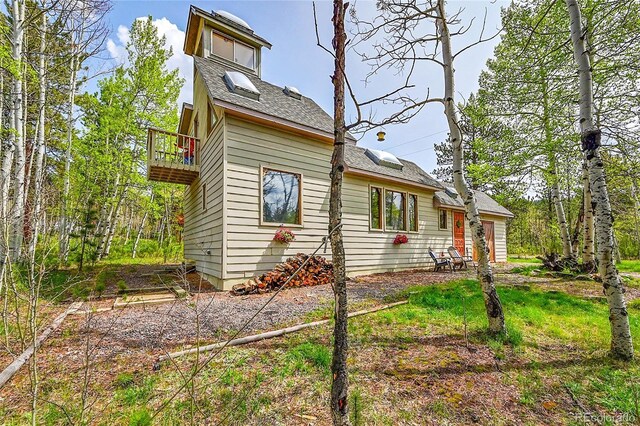 101 Campbell Rd, Bailey, CO 80421 - view of side of home with a balcony and a shingled roof