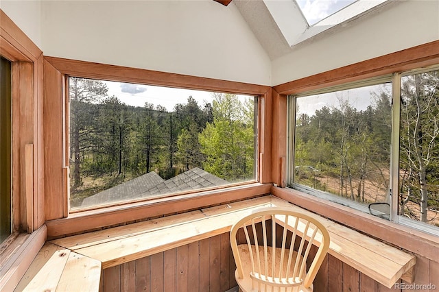 101 Campbell Rd, Bailey, CO 80421 - unfurnished sunroom featuring a skylight, vaulted ceiling, and a view of trees