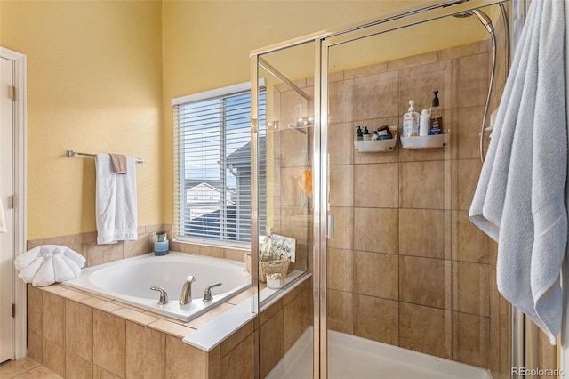 full bath featuring a stall shower and a garden tub