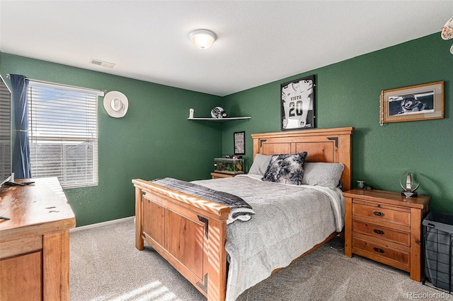 bedroom featuring visible vents, carpet floors, and baseboards