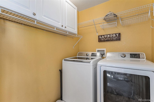 laundry area featuring cabinet space and independent washer and dryer