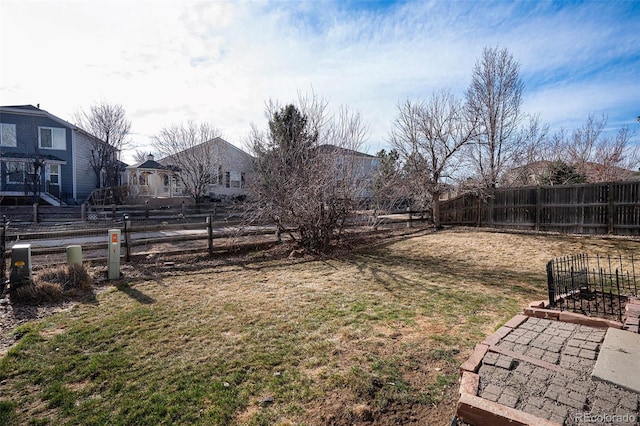 view of yard with a fenced backyard