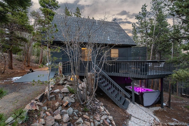 236 Harris Dr, Idaho Springs, CO 80452 - back of property with a deck, roof with shingles, and stairs