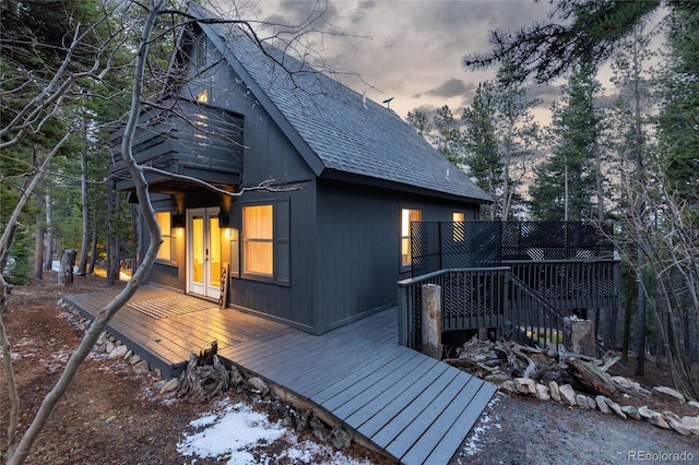 236 Harris Dr, Idaho Springs, CO 80452 - view of property exterior with a shingled roof and a wooden deck