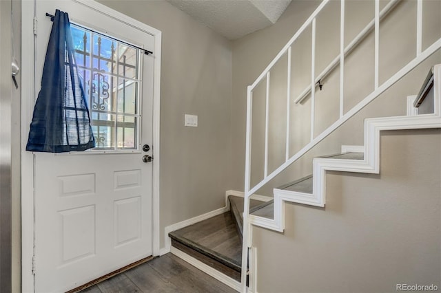 3618 Queen Anne Way, Colorado Springs, CO 80917 - entryway featuring baseboards, dark wood-style floors, and stairway