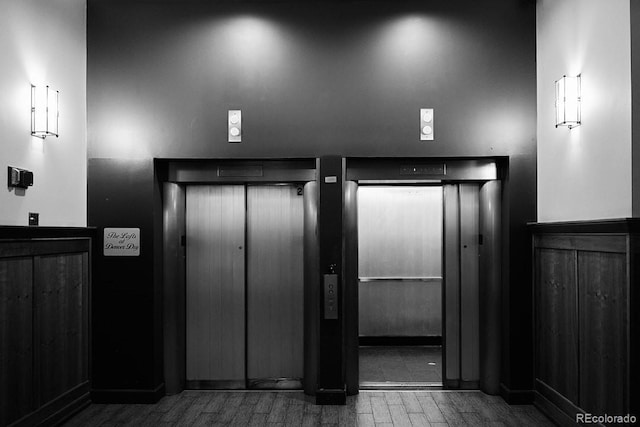 room details featuring elevator and hardwood / wood-style flooring