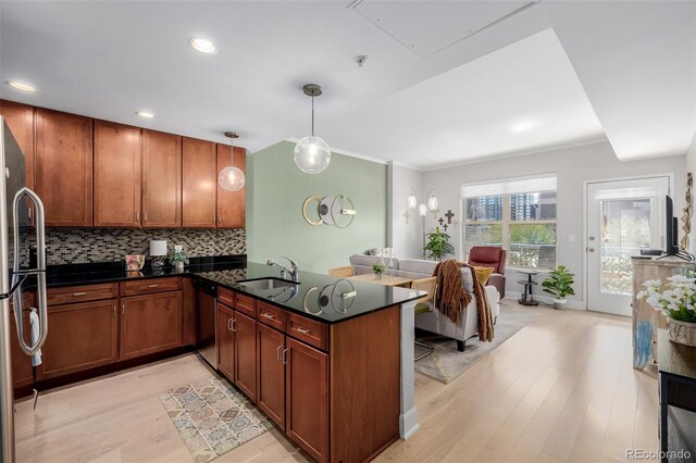 1975 N Grant St Unit 509, Denver, CO 80203 - kitchen with a sink, appliances with stainless steel finishes, light wood finished floors, decorative backsplash, and recessed lighting