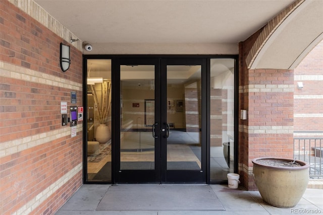 1975 N Grant St Unit 509, Denver, CO 80203 - entrance to property with brick siding, a surveillance system, and french doors