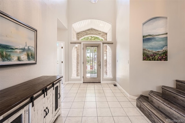 12705 Kalamath Ct, Westminster, CO 80234 - entryway with light tile patterned floors, lofted ceiling, and stairs
