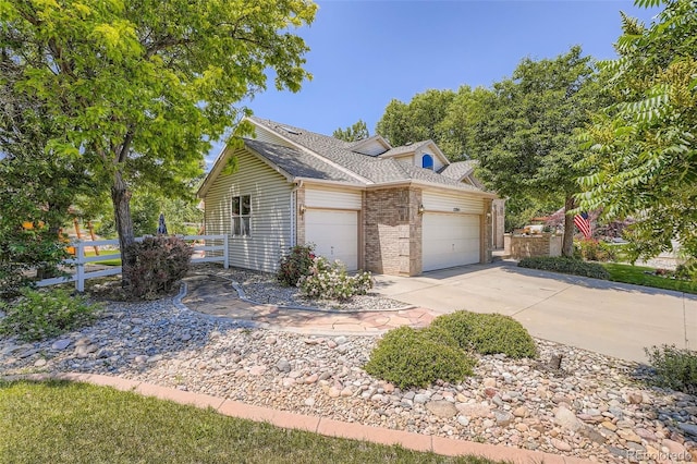 12705 Kalamath Ct, Westminster, CO 80234 - view of front of home featuring brick siding, a garage, driveway, and roof with shingles