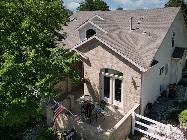 12705 Kalamath Ct, Westminster, CO 80234 - back of property with brick siding, a shingled roof, and a patio