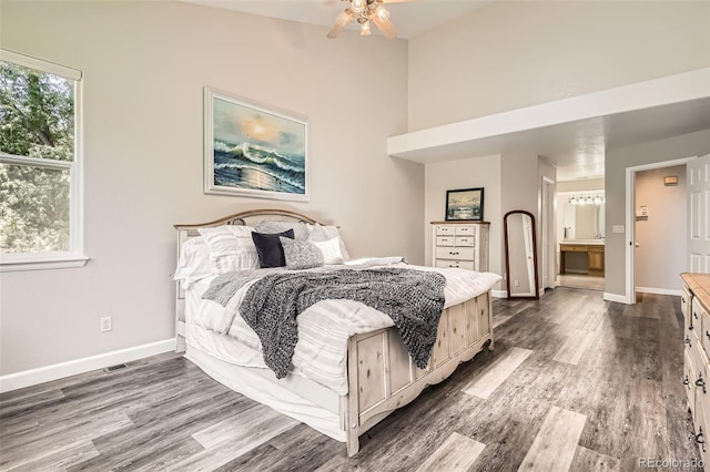 12705 Kalamath Ct, Westminster, CO 80234 - bedroom featuring dark wood finished floors and connected bathroom