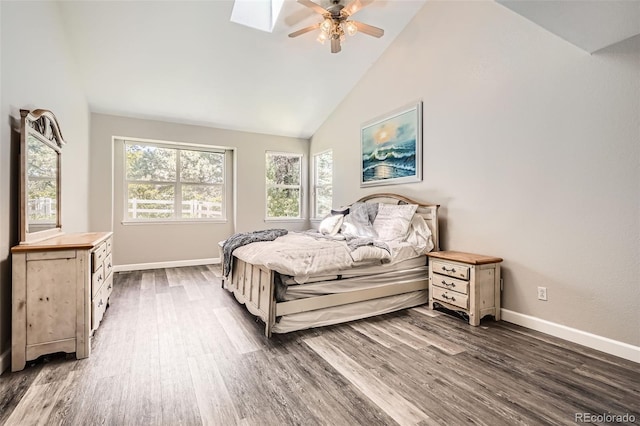 12705 Kalamath Ct, Westminster, CO 80234 - bedroom with multiple windows, dark wood-style flooring, high vaulted ceiling, and a ceiling fan