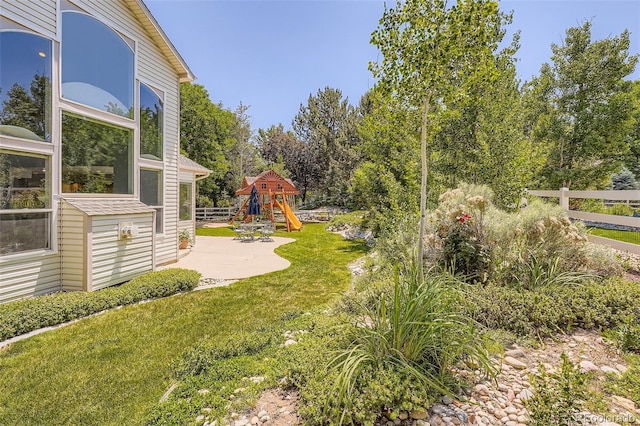 12705 Kalamath Ct, Westminster, CO 80234 - view of yard with a playground and a patio area