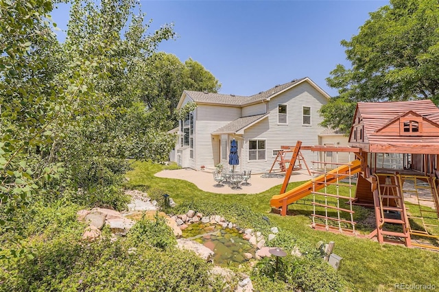 12705 Kalamath Ct, Westminster, CO 80234 - back of property with a playground, a patio area, and a yard