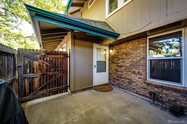 doorway to property with a patio area