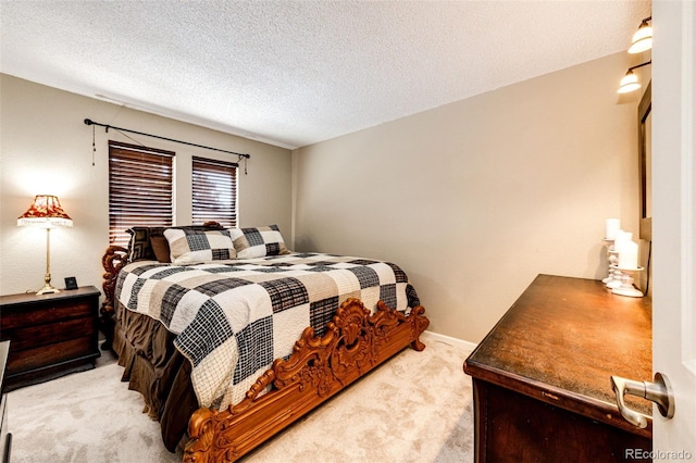 carpeted bedroom with a textured ceiling