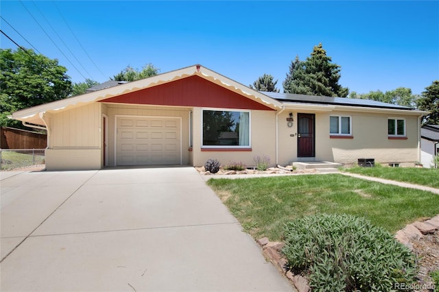 5067 S Mabre Ct, Littleton, CO 80123 - ranch-style house with concrete driveway, a garage, solar panels, and brick siding