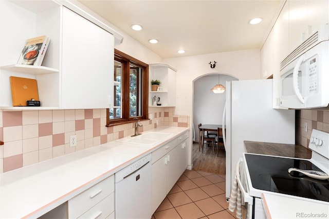 5067 S Mabre Ct, Littleton, CO 80123 - kitchen with white appliances, open shelves, white cabinets, decorative backsplash, and recessed lighting