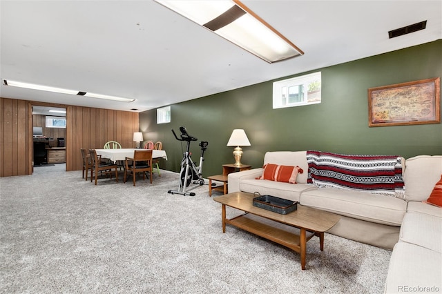 5067 S Mabre Ct, Littleton, CO 80123 - living room featuring plenty of natural light, carpet flooring, and wooden walls