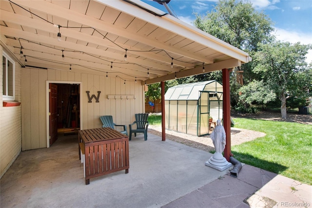 5067 S Mabre Ct, Littleton, CO 80123 - view of patio with a greenhouse and an outbuilding