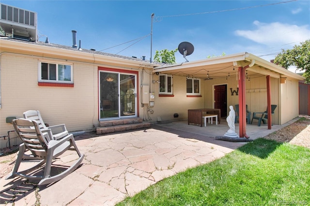 5067 S Mabre Ct, Littleton, CO 80123 - rear view of house with a patio area and brick siding
