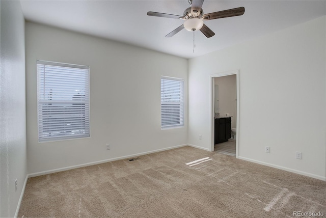 carpeted empty room with ceiling fan