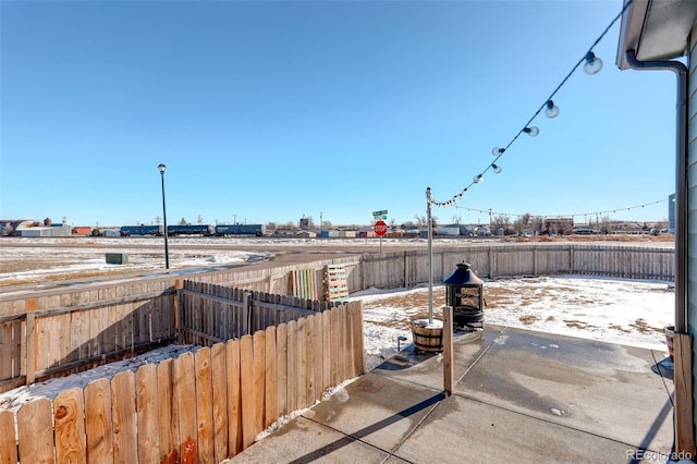 view of snow covered patio